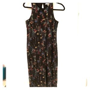 Knee length fitted flowery black dress